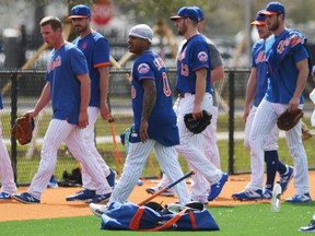 Mets pitcher Marcus Stroman (centre) and teammates complete warmups during a morning spring training workout in Port St. Lucie, Fla., on Wednesday, Feb. 12, 2020.