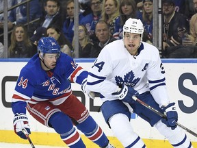 Toronto Maple Leafs centre Auston Matthews skates with the puck as New York Rangers centre Greg McKegg defends during the first period at Madison Square Garden on Feb. 5, 2020.