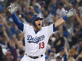 Max Muncy of the Los Angeles Dodgers celebrates his home run against the Boston Red Sox in Game 3 of the World Series at Dodger Stadium on October 26, 2018 in Los Angeles. (Harry How/Getty Images)