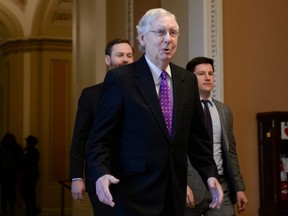 Senate Majority Leader Mitch McConnell walks to his office after delivering remarks in the Senate chamber at the U.S. Capitol in Washington, D.C., on Tuesday, Feb. 4, 2020.