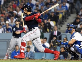 Mookie Betts of the Boston Red Sox hits a home run against the Los Angeles Dodgers in Game 5 of the World Series at Dodger Stadium on October 28, 2018 in Los Angeles. (Harry How/Getty Images)
