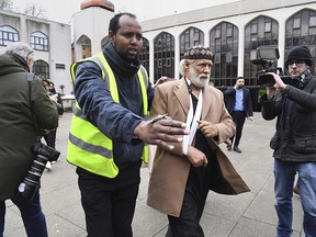 Stabbing victim, Muslim prayer leader Raafat Maglad, arrives at the London Central Mosque after being released from hospital, Friday Feb. 21, 2020. (Kirsty O'Connor/PA via AP)