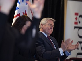 Newfoundland and Labrador Premier Dwight Ball applauds during an announcement made at Memorial University Signal Hill Campus in St. John's on Monday, February 10, 2020.