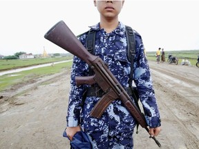 Myanmar police officer poses for a photograph in Maungdaw, Rakhine July 9, 2019. Picture taken on July 9, 2019.