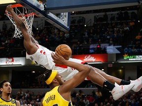 Toronto Raptors forward OG Anunoby dunks against Indiana Pacers centre Myles Turner during the third quarter at Bankers Life Fieldhouse in Indianapolis, Ind.