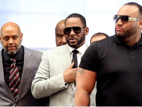 R. Kelly walks inside the Criminal Court Building as he arrives for a hearing on eleven new counts of criminal sexual abuse,  in Chicago, Illinois, U.S., June 6, 2019.
