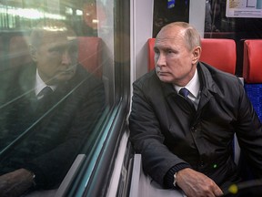 Russian President Vladimir Putin rides from Belorusskaya to Fili station on the Russian-made Ivolga train during the launch of the first routes of the Moscow Central Diameters. (Reuters File Photo)