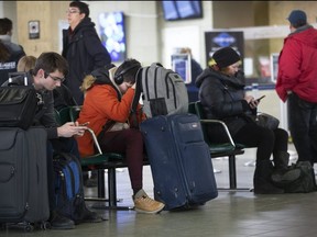 Bus travellers await transportation at Union Station in Toronto as thousands have been impacted by rail blockades on Friday, Feb. 14, 2020. (Stan Behal/Toronto Sun/Postmedia Network)