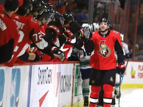 Senators’ Bobby Ryan celebrates the first of his three goals against the Canucks on Thursday night in Ottawa. (THE CANADIAN PRESS)