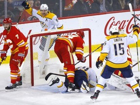 Calgary Flames goalie Cam Talbot is scored on by Nashville Predators Mikael Granlund in second-period action of at the Scotiabank Saddledome in Calgary on Thursday night.