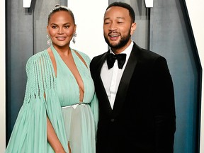 Chrissy Teigen and John Legend attend the 2020 Vanity Fair Oscar Party hosted by Radhika Jones at Wallis Annenberg Center for the Performing Arts on Feb. 9, 2020, in Beverly Hills, Calif.