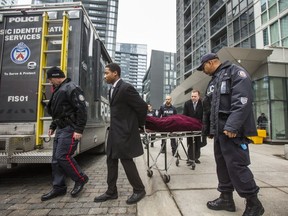 The first of two bodies is removed at the scene of a shooting from the previous night at 85 Queens Wharf Rd. In Toronto on Saturday, Feb. 1, 2020. Three young men were killed and two others injured when gunfire erupted during a party at an Airbnb condo at this address. (Ernest Doroszuk/Toronto Sun/Postmedia Network)