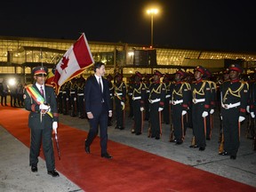 Prime Minister Justin Trudeau inspects an honour guard as he arrives in Addis Ababa, Ethiopia on Friday, Feb. 7, 2020.