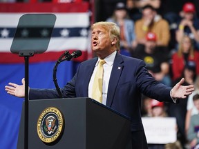 U.S. President Donald Trump gestures as he holds a campaign rally in Colorado Springs, Colorado, February 20, 2020. REUTERS/Kevin Lamarque ORG XMIT: SIN14