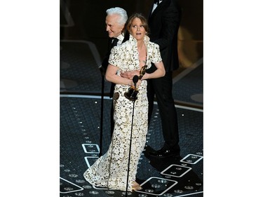 Actress Melissa Leo reacts as actor Kirk Douglas presents her with the trophy for Best Supporting Actress on stage at the 83rd Annual Academy Awards held at the Kodak Theatre on Feb. 27, 2011 in Hollywood, Calif.