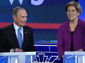 Former New York City Mayor Mike Bloomberg talks with Senator Elizabeth Warren during a break at the ninth Democratic 2020 U.S. Presidential candidates debate at the Paris Theater in Las Vegas Nevada, U.S., February 19, 2020.