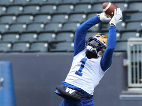 Receiver Darvin Adams goes up to make a catch during Winnipeg Blue Bombers practice.