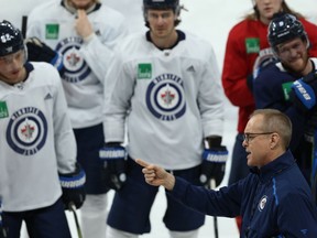 Head coach Paul Maurice (bottom right) makes a point during Winnipeg Jets practice at Bell MTS Place on Mon., Feb. 3, 2020. Kevin King/Winnipeg Sun/Postmedia Network