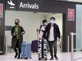 Passengers from a China Southern Airlines flight arrive at Perth International Airport in Perth, Australia, on Sunday, Feb. 2, 2020.