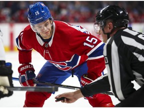 The Montreal Canadiens' Jesperi Kotkaniemi keeps his eye on the puck as he gets ready to take faceoff during NHL game against the San Jose Sharks at the Bell Centre in Montreal on Oct. 24, 2019.