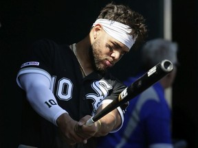 Yoan Moncada of the Chicago White Sox swings his bat in the dugout during the fifth inning of a game against the Detroit Tigers at Comerica Park on April 21, 2019 in Detroit, Michigan.