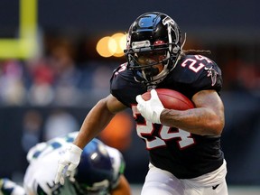 Devonta Freeman of the Atlanta Falcons rushes against the Seattle Seahawks at Mercedes-Benz Stadium on October 27, 2019 in Atlanta, Georgia.