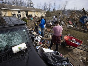 Volunteers work to clean up tornado-damaged areas on March 4, 2020 in Cookeville, Tennessee.
