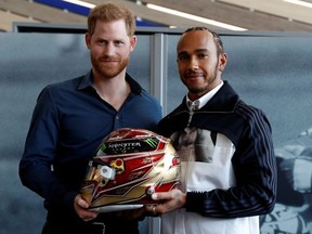 Prince Harry, Duke of Sussex and Formula One World Champion Lewis Hamilton pose at The Silverstone Experience at Silverstone on March 6, 2020 in Northampton, England.