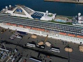 Passengers disembark from the Princess Cruises Grand Princess cruise as it sits docked in the Port of Oakland on March 10, 2020 in Oakland, Calif.