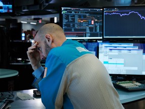 Traders work on the floor of the New York Stock Exchange (NYSE) on March 18, 2020 in New York City. (Spencer Platt/Getty Images)