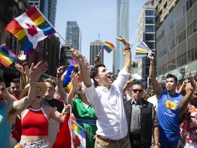 Prime Minister Justin Trudeau walks in Toronto's Pride parade, on Sunday, June 23, 2019. (THE CANADIAN PRESS/Chris Young)