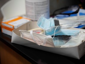 Protective masks at the Microbiology Research Facility, where researchers are beginning a trial to see whether malaria treatment hydroxychloroquine can prevent or reduce the severity of the coronavirus disease (COVID-19), at the University of Minnesota in Minneapolis, March 19, 2020.  REUTERS/Craig Lassig