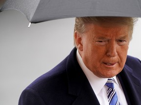 U.S. President Donald Trump speaks to the media as he departs for a day trip to Norfolk, Virginia, from the White House in Washington, U.S., March 28, 2020. (REUTERS/Joshua Roberts)