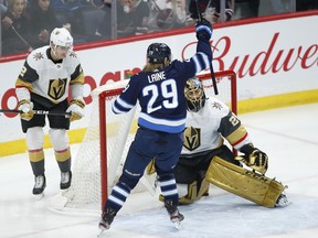 Winnipeg Jets' Patrik Laine (29) celebrates after teammate Nikolaj Ehlers, not shown, scores on Vegas Golden Knights goaltender Marc-Andre Fleury during first period on Friday night. THE CANADIAN PRESS/John Woods