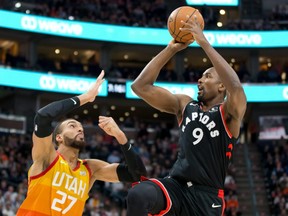 The Raptors’ Serge Ibaka (right) shoots over Jazz centre Rudy Gobert on March 9. The Raptors won the game, it was their final tilt before the league shut down.