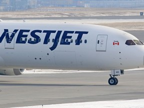 A WestJet Boeing 787 Dreamliner arrives from London in Calgary on Tuesday, March 17, 2020.