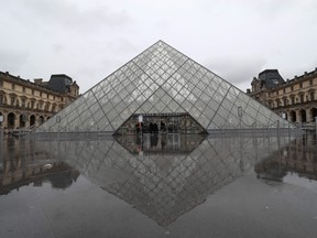 A view of the deserted court yard outside the closed Pyramid, the main entrance to the Louvre museum which was once a royal residence, located in central in Paris on March 2, 2020. (LUDOVIC MARIN/AFP via Getty Images)