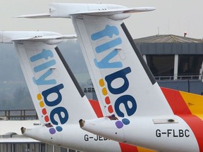 Flybe aircraft are pictured on the tarmac at Exeter airport in Exeter, south-west England on March 5, 2020, following the news that the airline had collapsed into bankruptcy.
