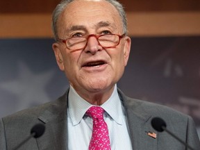 Senate Democratic Leader Senator Chuck Schumer, Democrat of New York, speaks alongside fellow Democratic Senators about a new economic and community relief proposal to help states with coronavirus outbreaks during a press conference at the US Capitol in Washington, DC, March 11, 2020.