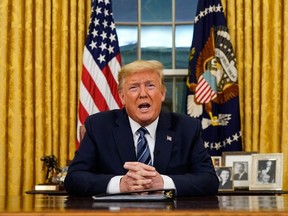 US President Donald Trump addresses the Nation from the Oval Office about the widening novel coronavirus (Covid-19) crisis in Washington, DC on March 11, 2020.