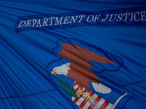 In this file photo taken on July 22, 2019, the U.S. Department of Justice flag is seen in Washington, D.C. (ALASTAIR PIKE/AFP via Getty Images)