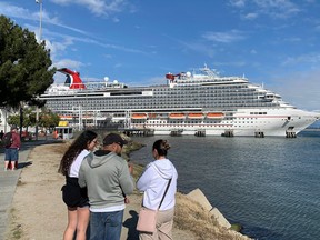 In this file photo taken on March 7, 2020, a Carnival Panorama cruise ship is seen docked in Long Beach, California as passengers await onboard for the results of a COVID-19 (Coronavirus) test given to an ill passenger. (MARK RALSTON/AFP via Getty Images)