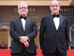 In this file photo taken on May 18, 2018 the General Delegate of the Cannes Film Festival Thierry Fremaux (L) and the President of the Cannes Film Festival Pierre Lescure look at guests arriving for the screening of the film "The Wild Pear Tree (Ahlat Agaci)" at the 71st edition of the Cannes Film Festival in Cannes, southern France. (VALERY HACHE/AFP via Getty Images)