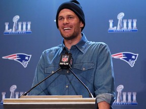 In this January 31, 2019, file photo former New England Patriots quarterback Tom Brady talks to the press during a media availability at the Super Bowl Media Center at the World Congress Center in Atlanta, Ga.