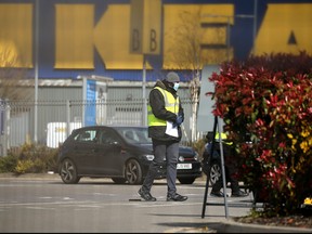 Britain's NHS workers wait in their cars to be tested for COVID-19 at a drive-in facility set up in the car park of an Ikea store in Wembley, north-west London on March 31, 2020. (ISABEL INFANTES/AFP via Getty Images)