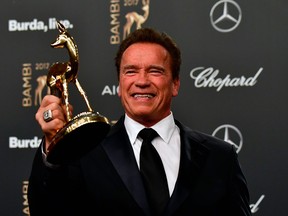 US actor and founder of the R20 climate action group Arnold Schwarzenegger poses after receiving the 2017 Bambi Award in the "Our Earth" category during the award ceremony on November 16, 2017 at the Stage Theatre.(TOBIAS SCHWARZ/AFP/Getty Images)