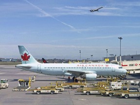 In this file photo, an Air Canada plane sits on the tarmac at Trudeau airport near Montreal. (DANIEL SLIM/AFP via Getty Images)