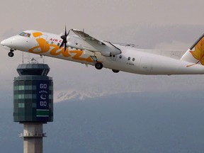 In this May 30, 2011, file photo, an Air Canada Jazz De Havilland DHC-8 takes off at Vancouver International Airport in Richmond, B.C.