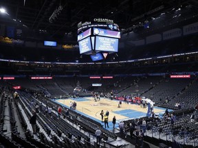 Fans leave after an announcement that the Oklahoma City Thunder vs. Utah Jazz game is canceled just before the tip off at Chesapeake Energy Arena.