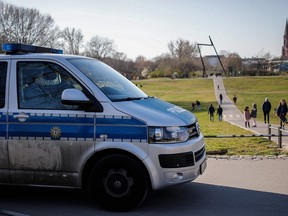 Police patrol in Gorlitzer park in Berlin's Kreuzberg district on March 24, 2020. (DAVID GANNON/AFP via Getty Images)